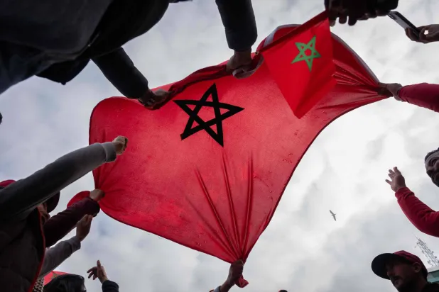  People wave Morocco's flag in the old town of Rabat, on January 9, 2026 prior the Africa Cup of Nations (CAN) quarter-final football match Morocco v Cameroon. (AFP) 
