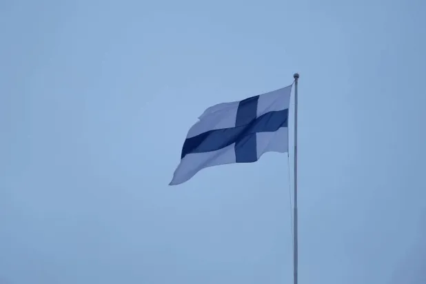 A Finnish flag flies over the City Hall in Helsinki, Finland, February 10, 2024. REUTERS/Tom Little/File photo
