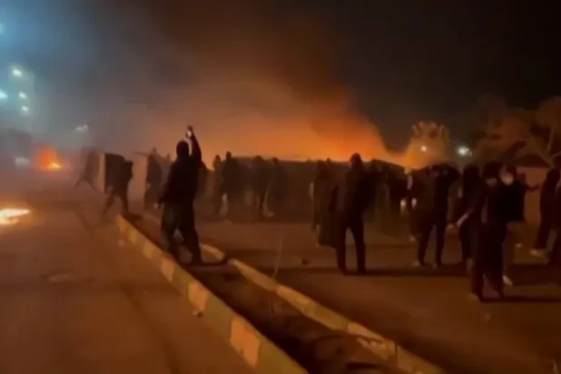 This video grab taken on January 13, 2026 from UGC images posted on social media on January 10, 2026 shows clashes in Mashhad, in northeastern Iran. (UGC/AFP)