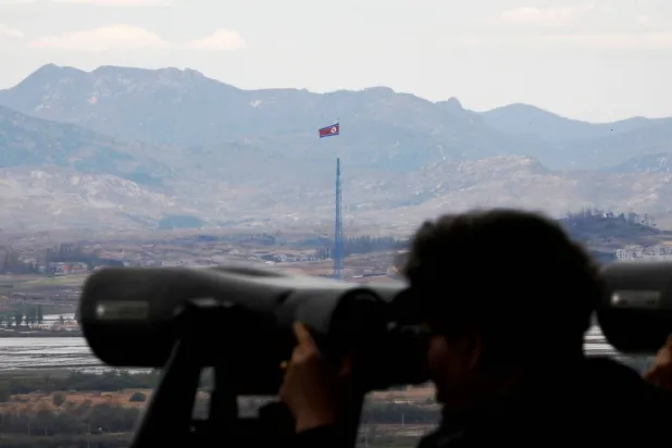 A North Korean flag flutters on top of a 160-meter tower in North Korea's propaganda village of Gijungdong in this picture taken from the Dora observatory near the demilitarized zone separating the two Koreas, in Paju, South Korea, April 24, 2018. (Reuters)