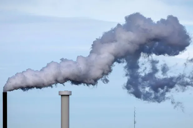 This photograph taken in Lanester, western France on May 31, 2025, shows smoke rising from a factory. (AFP)