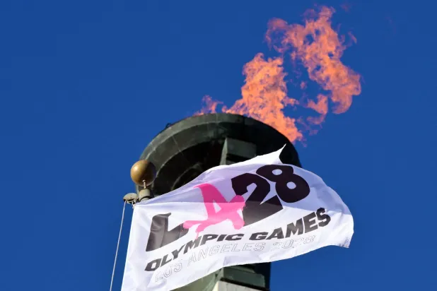 The LA28 Olympic cauldron is lit during a ceremonial lighting at the Memorial Coliseum in Los Angeles on January 13, 2026, ahead of the launch of ticket registration for the 2028 Summer Olympic Games. (AFP)