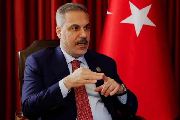 Turkish Foreign Minister Hakan Fidan speaks during an interview with Reuters at the 23rd edition of the annual Doha Forum, in Doha, Qatar, December 6, 2025. REUTERS/Ibraheem Abu Mustafa