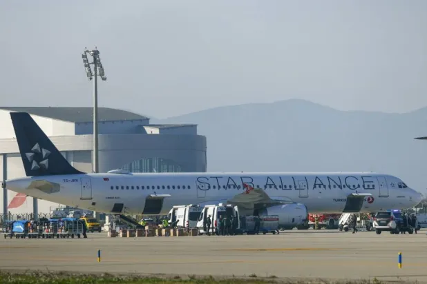 A Turkish Airlines aircraft after landing at El Prat airport, in Barcelona, northeastern Spain, 15 January 2026, after Spanish security forces where alerted due to a bomb threat on board the aircraft. (EPA) 
