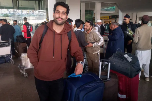  A Pakistani medical student Arslan Haider waits at the airport after arriving from Tehran on a commercial flight amid the ongoing nationwide protests in Iran, in Islamabad, Pakistan, January 15, 2026. (Reuters)