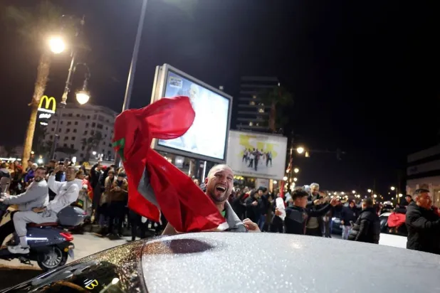  Soccer Football - CAF Africa Cup of Nations - Morocco 2025 - Tangier, Morocco - January 14, 2026 Morocco fans celebrate after winning their semi-final against Nigeria. (Reuters)