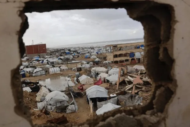 Tents sheltering displaced Palestinian families line Gaza City’s coastline as strong winter winds sweep the enclave (AFP)   