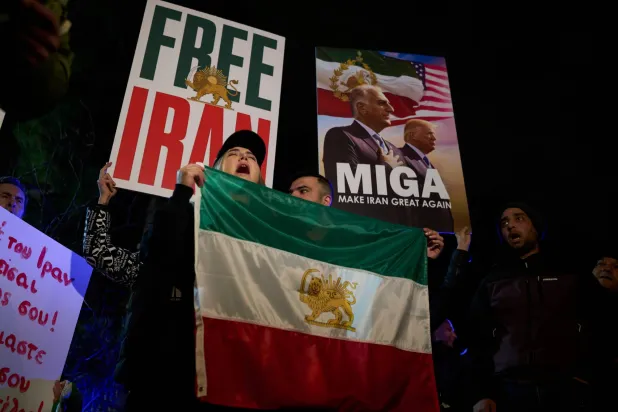 Iranians who live in Greece gather to rally outside the Iranian embassy in Athens, Friday, Jan. 16, 2026, in support of Iran's anti-government protests. (AP Photo/Petros Giannakouris)