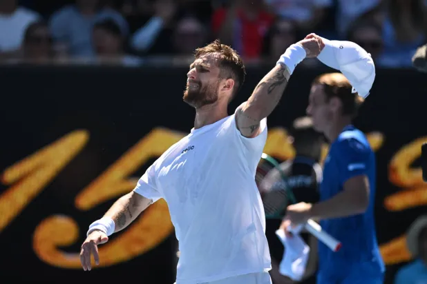 Corentin Moutet of France reacts after winning the Men’s 1st round match against Tristan Schoolkate of Australia on day 1 of the 2026 Australian Open tennis tournament at Melbourne Park in Melbourne, Australia, 18 January 2026. (EPA)