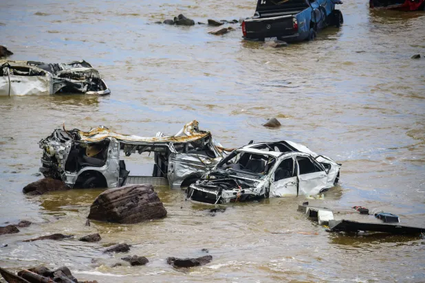 Some of the more than ten cars washed into the surf by the flood at the Cumberland River Caravan park after flash flooding near the Wye River, Australia, 16 January 2026. EPA/MICHAEL CURRIE AUSTRALIA AND NEW ZEALAND OUT