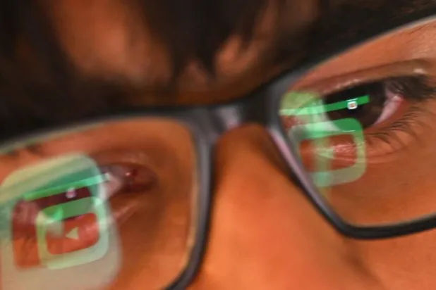 Some experts worry a blanket ban on social media could have unintended consequences. Saeed KHAN / AFP/File
