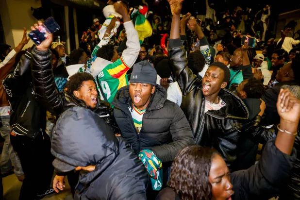 Senegal fans celebrate in Turin, Italy Sunday, Jan. 18, 2026, after Senegal won the Africa Cup of Nations final soccer match against Morocco. (Giulio Lapone/LaPresse via AP)