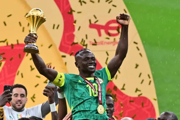 Sadio Mane of Senegal celebrates holding the trophy after winning the CAF Africa Cup of Nations after the final match between Senegal and Morocco in Rabat, Morocco, 18 January 2026. (EPA)