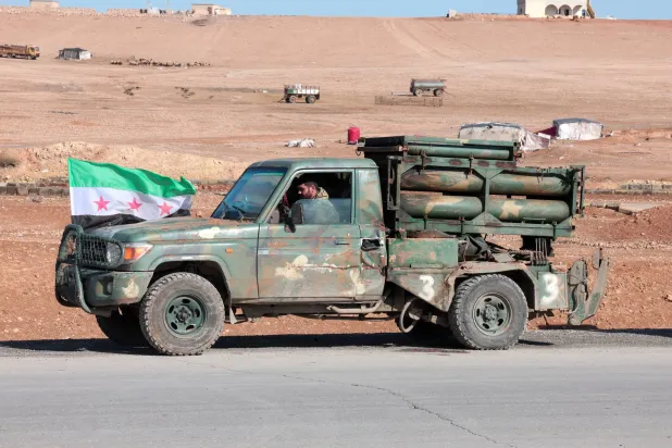 A military vehicle of the Syrian army is parked on the highway near Tabqa, after the Syrian army took control of it, Syria, January 19, 2026. (Reuters)
