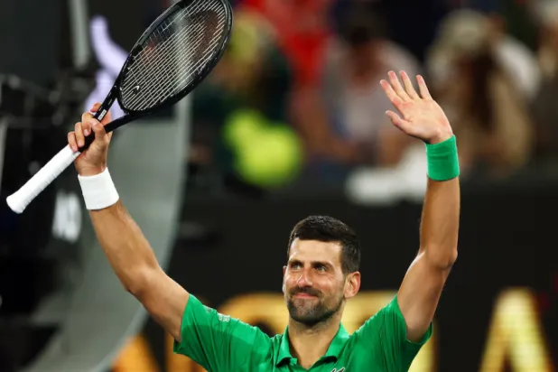  Tennis - Australian Open - Melbourne Park, Melbourne, Australia - January 19, 2026 Serbia's Novak Djokovic celebrates after winning his first round match against Spain's Pedro Martinez REUTERS/Tingshu Wang 