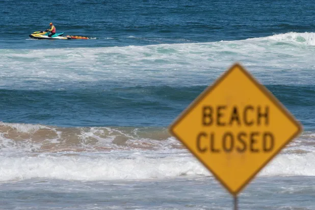 A lifeguard patrols North Steyne beach as beaches are closed after recent shark attacks, in Sydney, Australia, January 20, 2026. (Reuters)