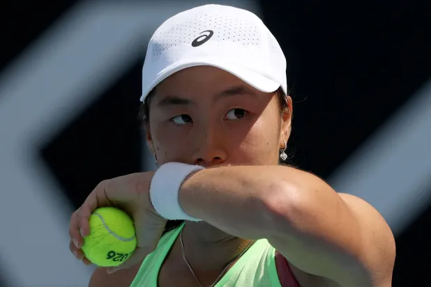 Indonesia's Janice Tjen prepares to serve Canada's Leylah Fernandez during their women's singles match on day three of the Australian Open tennis tournament in Melbourne on January 20, 2026. (AFP)