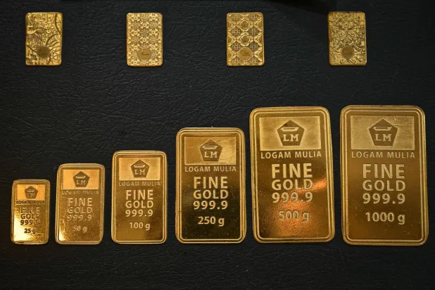 (FILES) Gold wafers are displayed at Galeri 24, a state-owned gold retailer, in Surabaya, East Java, on October 16, 2025, as Indonesia's gold price stays near record highs and demand for safe-haven assets remains strong. (Photo by Juni KRISWANTO / AFP)