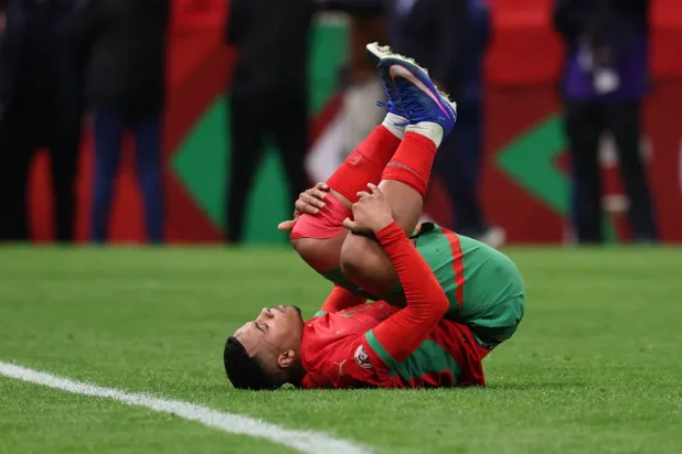 Morocco's forward #07 Hamza Igamane reacts as he misses his penatly during the Africa Cup of Nations (CAN) semi-final football match between Nigeria and Morocco at the Prince Moulay Abdellah stadium in Rabat on January 14, 2026. (Photo by FRANCK FIFE / AFP)