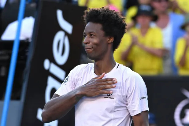 Gael Monfils of France acknowledges to the crowds after losing his Men’s Singles first round match against Dane Sweeny of Australia at the Australian Open tennis tournament in Melbourne, Australia, 20 January 2026. (EPA)
