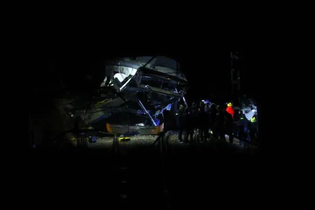 Emergency services personnel work at the site where a train crashed into a collapsed retaining wall between Gelida and Sant Sadurni d'Anoia, Barcelona, Spain, late 20 January 2026. (EPA)