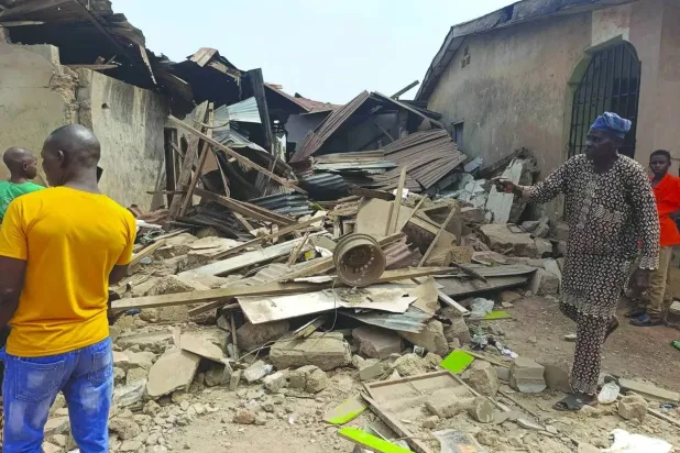 Residents inspect the damage after US forces had launched a strike against ISIS militants in Nigeria at the request of Nigeria's government in Offa, Kwara State, Nigeria, December 26, 2025. REUTERS/Abdullahi Dare Akogun/File Photo 