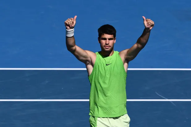 Carlos Alcaraz of Spain celebrates match point during his men's singles third-round match against Corentin Moutet of France on day six of the 2026 Australian Open tennis tournament at Melbourne Park in Melbourne, Australia, 23 January 2026. (EPA)