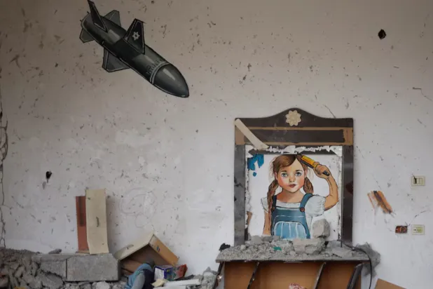 A painting drawn by artists is seen at a house destroyed by Israel, in recent Israeli-Gaza fighting, in Deir Al-Balah, central Gaza Strip June 13, 2023. REUTERS/Mohammed Salem 
