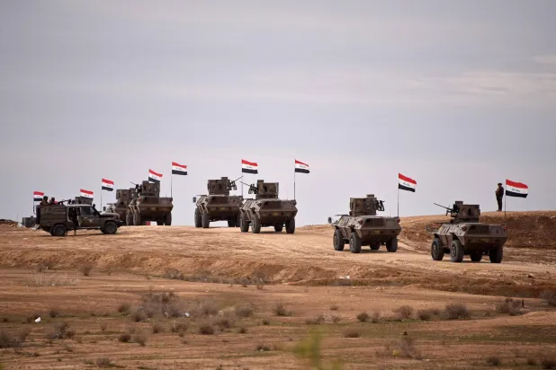Iraqi border security force personnel patrol in their armored vehicles along the border with Syria, in Sinjar district, northern Iraq on January 22, 2026. (AFP)