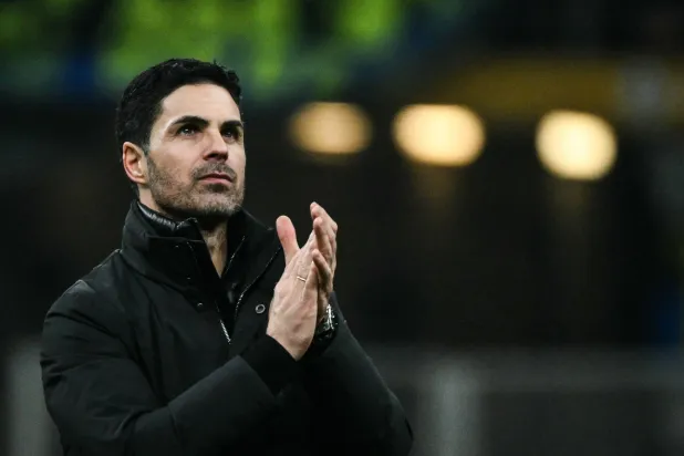 Arsenal's Spanish manager Mikel Arteta applauds at the end of the UEFA Champions League, league phase day 7, football match between Inter Milan and Arsenal at San Siro stadium in Milan, northern Italy, on January 20, 2026. (AFP)