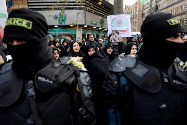 FILE PHOTO: People attend the funeral of the security forces who were killed in the protests that erupted over the collapse of the currency's value in Tehran, Iran, January 14, 2026. Majid Asgaripour/WANA (West Asia News Agency) via REUTERS  