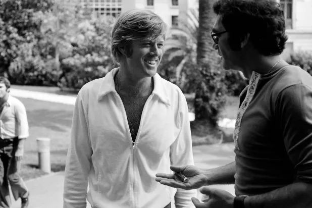 (FILES) Photo taken in May 1972 shows US actor Robert Redford (L) and director Sydney Pollack during the International Film Festival in Cannes. (Photo by AFP)