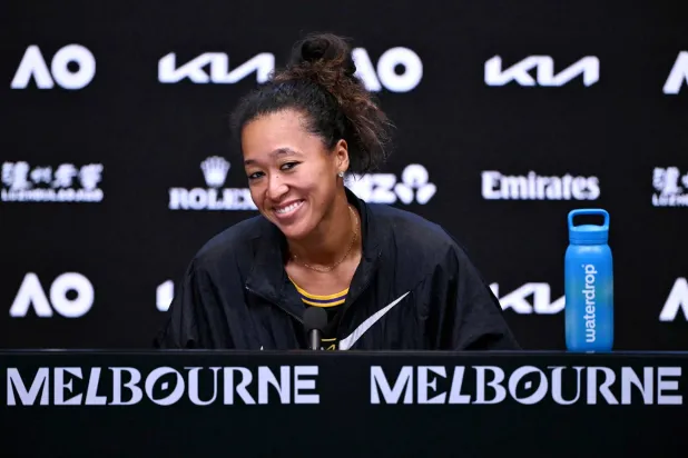 TOPSHOT - Japan's Naomi Osaka attends a press conference after winning her women's singles match against Romania's Sorana Cirstea on day five of the Australian Open tennis tournament in Melbourne on January 22, 2026. (Photo by WILLIAM WEST / AFP) 