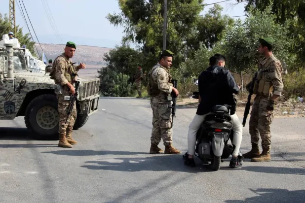 Lebanese soldiers check the identity of a man in Marjeyoun, southern Lebanon. (Reuters file)