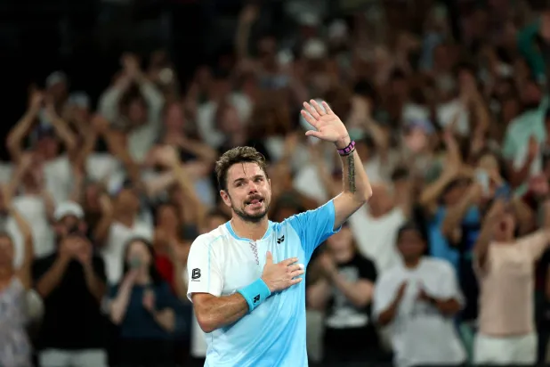  Tennis - Australian Open - Melbourne Park, Melbourne, Australia - January 24, 2026 Switzerland's Stan Wawrinka applauds fans in the stands after losing his third round match against Taylor Fritz of the US. (Reuters)