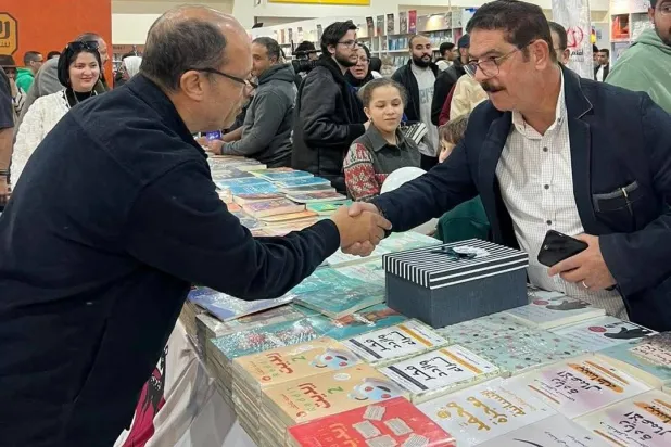 اللواء وليد السيسي في معرض القاهرة الدولي للكتاب (الشرق الأوسط)