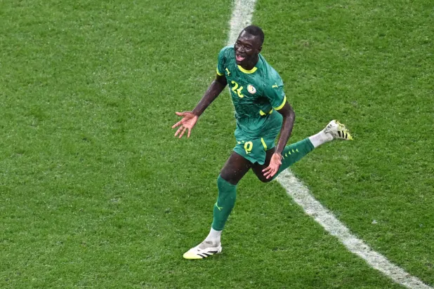 Senegal's midfielder #26 Pape Gueye celebrates after the Africa Cup of Nations (CAN) final football match between Senegal and Morocco at the Prince Moulay Abdellah Stadium in Rabat on January 18, 2026. (AFP)