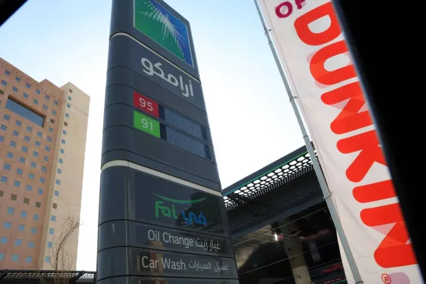 A picture taken in Riyadh shows the sign in Arabic of an Aramco gas station on the outskirts of the Saudi capital Riyadh on November 5, 2024. AFP 