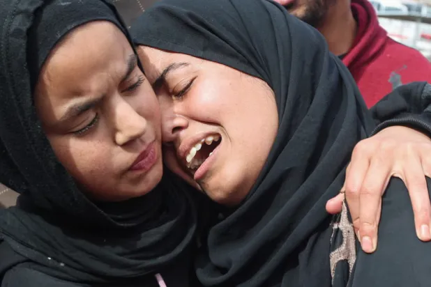 Mourners react during the funeral of Palestinians who, according to medics, were killed by Israeli gunfire on Thursday, at Nasser Hospital in Khan Younis, in the southern Gaza Strip. REUTERS/Ramadan Abed 