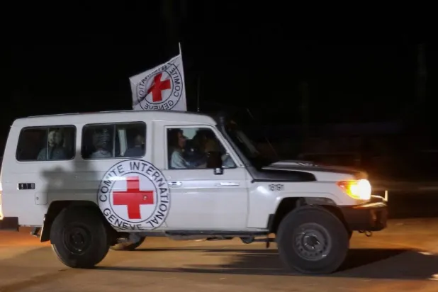 A Red Cross vehicle, as part of a convoy believed to be carrying hostages abducted by Hamas armed men during the Oct. 7 attack on Israel, arrives at the Rafah border, amid a hostages swap deal between Hamas and Israel, in the southern Gaza Strip, Nov. 24, 2023. (Reuters)
