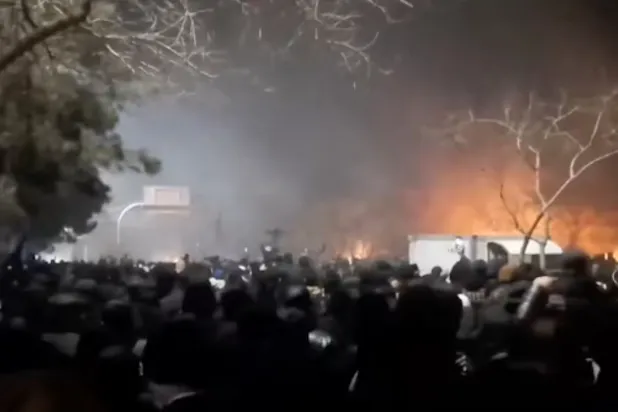 Smoke rises as protesters gather amid evolving anti-government unrest at Vakilabad highway in Mashhad, Razavi Khorasan province, Iran, released on January 10, 2026, in this screen grab obtained from a social media video. SOCIAL MEDIA/via REUTERS 