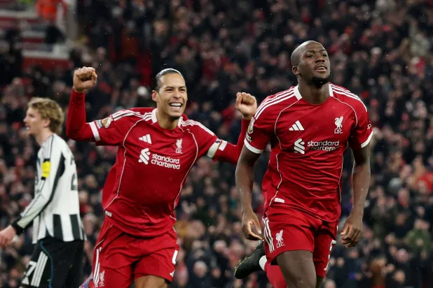 Football - Premier League - Liverpool v Newcastle United - Anfield, Liverpool, Britain - January 31, 2026 Liverpool's Ibrahima Konate celebrates scoring their fourth goal with Liverpool's Virgil van Dijk. (Reuters)