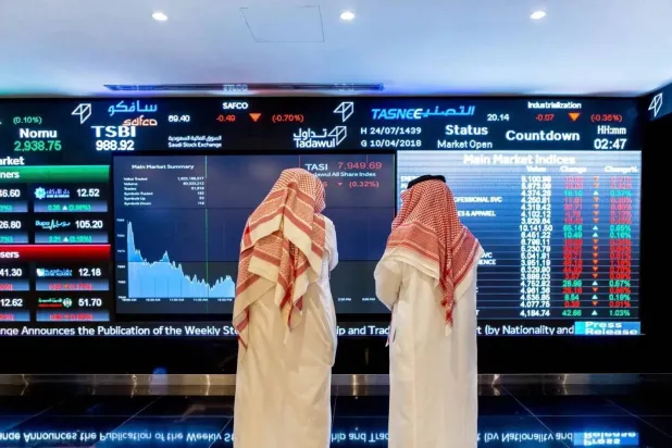 Traders watch a screen at the Saudi stock market. (Reuters)