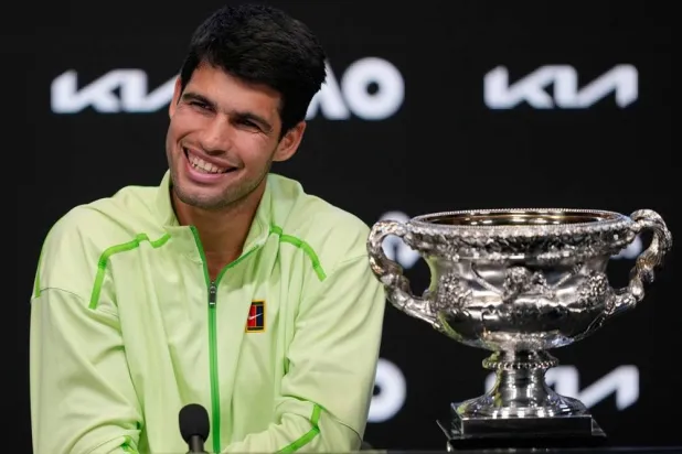  Carlos Alcaraz of Spain reacts during a press conference as he sits with the Norman Brookes Challenge Cup after defeating Novak Djokovic of Serbia in the men's singles final at the Australian Open tennis championship in Melbourne, Australia, early Monday, Feb. 2, 2026. (AP) 
