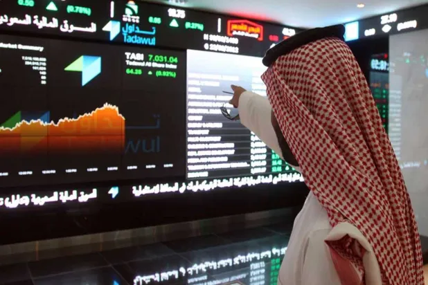 A trader monitors stock movements on a screen at the Saudi stock exchange. (Reuters)