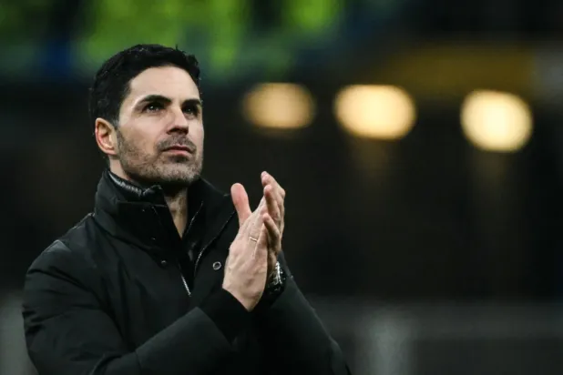 Arsenal's Spanish manager Mikel Arteta applauds at the end of the UEFA Champions League, league phase day 7, football match between Inter Milan and Arsenal at San Siro stadium in Milan, northern Italy, on January 20, 2026. (AFP)
