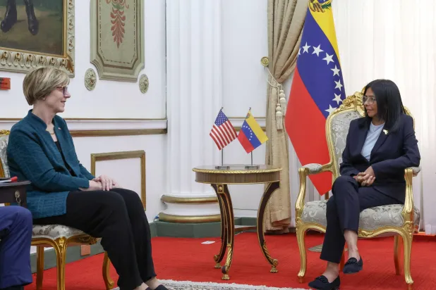 This handout picture released by the Venezuelan Presidency shows Venezuela's interim President Delcy Rodriguez (R) talking with the new head of the United States diplomatic mission for Venezuela Laura Dogu during meeting at the Miraflores Presidential Palace in Caracas on February 2, 2026. (Daniela Millan / Venezuelan Presidency / AFP)