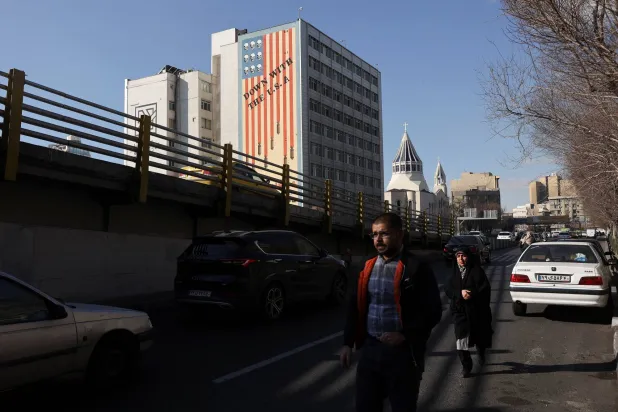 People walk near an anti-US mural on a building in Tehran, Iran, January 31, 2026. Majid Asgaripour/WANA (West Asia News Agency) via Reuters