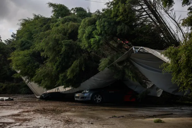 A car is smashed due to storm Kristin, in Leiria, Portugal, February 2, 2026. (Reuters)