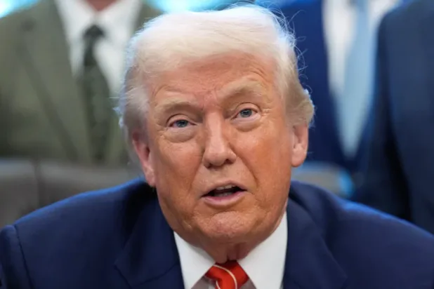 President Donald Trump speaks to reporters after signing a spending bill that ends a partial shutdown of the federal government in the Oval Office of the White House, Tuesday, Feb. 3, 2026, in Washington. (AP Photo/Alex Brandon)